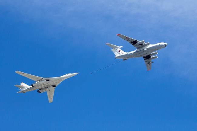 Russian Air Force's IL-78 air-to-air refuelling tanker, right, demonstrates in-flight refuelling of a Tu-160 strategic bomber over Red Square during the Victory Day military parade to celebrate 73 years since the end of WWII and the defeat of Nazi Germany, in Moscow, Russia, Wednesday, May 9, 2018. Military authorities say U.S. Air Force and Canadian fighter jets were scrambled to escort two Russian bombers that were travelling near the North American coastline. THE CANADIAN PRESS/AP Photo/Alexander Zemlianichenko