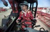 Renee Jones, first year apprentice crane operator, is seen on a RT 65 ton crane which she operates at Mammoet, in Edmonton Alta., on May 9, 2012. Jones got her start in the Women Building Futures program. THE CANADIAN PRESS/Jason Franson