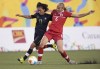 Canada's Rebecca Quinn (6) and Mexico's Monica Ocampo (11) battle for the ball during the first half of the 2015 Pan Am Games women's bronze medal soccer match in Hamilton, Ontario on Friday, July 24, 2015. Canadian international Quinn has returned to the NWSL, signing with Reign FC. THE CANADIAN PRESS/Peter Power