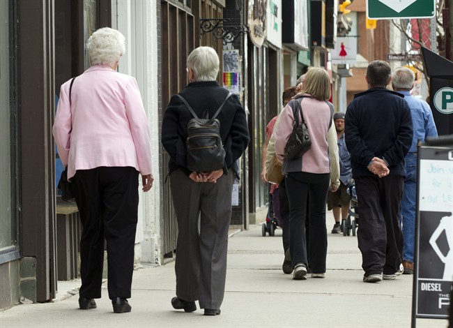 Senior citizens make their way down the a main street in Peterborough, Ontario on Monday May 7, 2012. THE CANADIAN PRESS/Frank Gunn