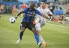 Montreal Impact's Rod Fanni, left, holds off a challenge by Atlanta United's Miguel Almiron during first half MLS soccer action in Montreal, Saturday, July 28, 2018. The Montreal Impact have signed French centre back Rod Fanni until the end of the 2019 season. THE CANADIAN PRESS/Graham Hughes