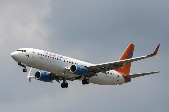 A Sunwing Boeing 737-800 passenger plane prepares to land at Pearson International Airport in Toronto on Wednesday, August 2, 2017. Transport Minister Marc Garneau faced an escalating dilemma Tuesday over Boeing's 737 Max 8 aircraft, which a growing number of countries have grounded or banned in the wake of the Ethiopian Airlines crash that killed 157 people Sunday. THE CANADIAN PRESS/Christopher Katsarov