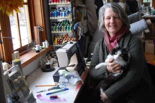 Sue Earle and her cat Louie pose for a photo in her sewing room on Salt Spring Island, B.C. in this undated handout photo. Elizabeth May chose Earth Day to get married and she wanted her wedding dress to be a garden of earthly delights. 