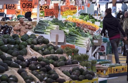 Various vegetables are on display for sale at the Jean Talon Market in Montreal on January 11, 2016. The fruit-and-vegetable-heavy fare touted in the new federal food guide may be too expensive -- or perhaps just not enticing enough -- to easily form the basis of most Canadians' diets, a new report suggests. Researchers at Dalhousie University and the University of Guelph found over 52 per cent of consumers surveyed said they face barriers in adopting the guide's recommendations. THE CANADIAN PRESS/Paul Chiasson