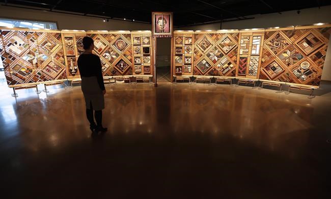 The National Centre for Truth and Reconciliation will reveal the names of 2,800 children who died in residential schools at a ceremony in Ottawa on Monday. Visitors to the Canadian Museum for Human Rights in Winnipeg can view a new exhibit called The Witness Blanket Monday, December 14, 2015. The 12-metre-long installation is made of more than 800 items collected from the sites and survivors of residential schools, in the style of a woven blanket. THE CANADIAN PRESS/John Woods