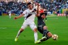 LA Galaxy defender Cristian Pavon, left, and Vancouver Whitecaps FC defender Jasser Khmiri battle for the ball during the first half of an MLS soccer match in Carson, Calif., Sunday, Sept. 29, 2019. THE CANADIAN PRESS/AP-Kelvin Kuo