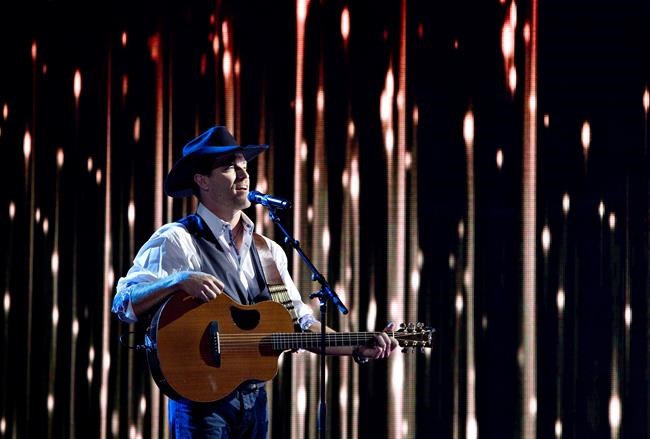 George Canyon performs during the Canadian Country Music Awards in Edmonton, Alberta on Sunday September 8, 2013. With his lantern jaw and big cowboy hat, country music star George Canyon is hard to miss as he campaigns for votes in rural Nova Scotia. THE CANADIAN PRESS/Jason Franson