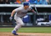 Los Angeles Dodgers' Jamie Romak breaks from the batter's box as he grounds out against the Colorado Rockies in the fourth inning of a baseball game in Denver on Sunday, June 8, 2014. Romak received countless text messages from friends across the world when video surfaced online of the Canadian player dressed as a 1950's American Army general at the Korean Baseball Organization's all-star game this month. THE CANADIAN PRESS/AP-David Zalubowski