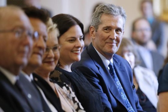 Premier Brian Pallister looks at some of his new provincial MLAs who were sworn into the Manitoba legislature in Winnipeg on September 25, 2019. Manitoba politicians are returning to the legislature for the first time since the provincial election three weeks ago. Premier Brian Pallister has said a short throne speech laying out his priorities will start the abbreviated, two-week session. THE CANADIAN PRESS/John Woods