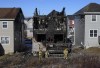 Firefighters investigate following a house fire in the Spryfield community in Halifax on Tuesday, February 19, 2019. Dozens of people gathered outside the charred remnants of a suburban Halifax home Tuesday night to mourn the loss of seven children killed in a fast-moving fire and to show support for the injured, grieving parents left behind. THE CANADIAN PRESS/Darren Calabrese