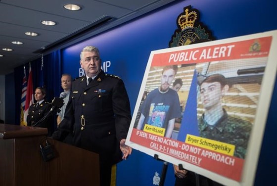 Security camera images recorded in Saskatchewan of Kam McLeod, 19, and Bryer Schmegelsky, 18, are displayed as RCMP Assistant Commissioner Kevin Hackett steps away from the podium after speaking during a news conference in Surrey, B.C., on Tuesday July 23, 2019. A nationwide manhunt was on Tuesday for two teenagers labelled by police as suspects in the deaths of three people in northern British Columbia. THE CANADIAN PRESS/Darryl Dyck