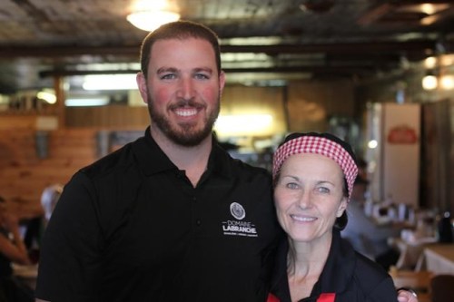 Marie-France DesGroseilliers and her son Louis pose for a photo at their family-owned sugar shack Domaine Labranche in Saint-Isidore, Quebec on Monday April 22, 2019. Fuelled by growing health and ethical concerns and culinary creativity, shifting eating habits have seen vegetarian and vegan dishes mushroom at cabanes a sucre across Quebec, along with a few pure vegan sugar shacks — heresy in recent times. THE CANADIAN PRESS/Christopher Reynolds