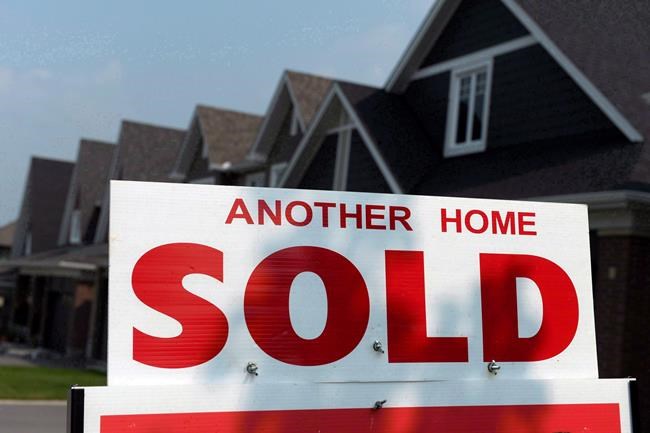 Sometime in the near future, the majority of mortgage applications in Canada will be completed online or with a chatbot, mortgage expert Rob McLister predicts. A for sale sign displays a sold home in a housing development in Ottawa on July 6, 2015. THE CANADIAN PRESS/Sean Kilpatrick