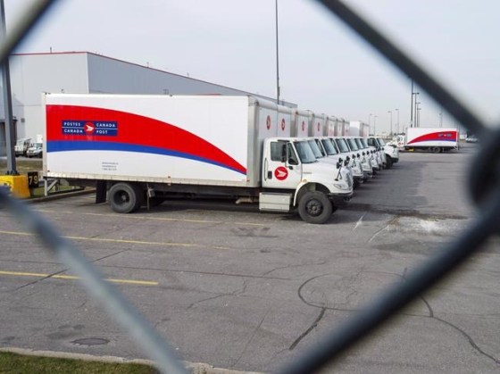 Idle Canada Post trucks sit in the parking lot of the Saint-Laurent sorting facility in Montreal as rotating strikes hit the area on Thursday November 15, 2018. Senators are to resume a special sitting today to examine a back-to-work bill that would force an end to rotating strikes at Canada Post as the walkouts enter their sixth week. THE CANADIAN PRESS/Ryan Remiorz
