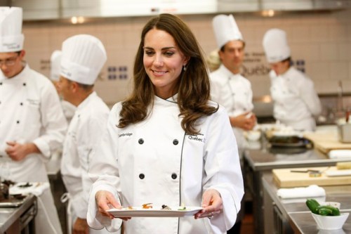 The Duchess of Cambridge carries a tray of hors d'oeuvres during a visit to the Quebec Tourism and Hotel Institute in Montreal on Saturday, July 2, 2011. THE CANADIAN PRESS/Ryan Remiorz