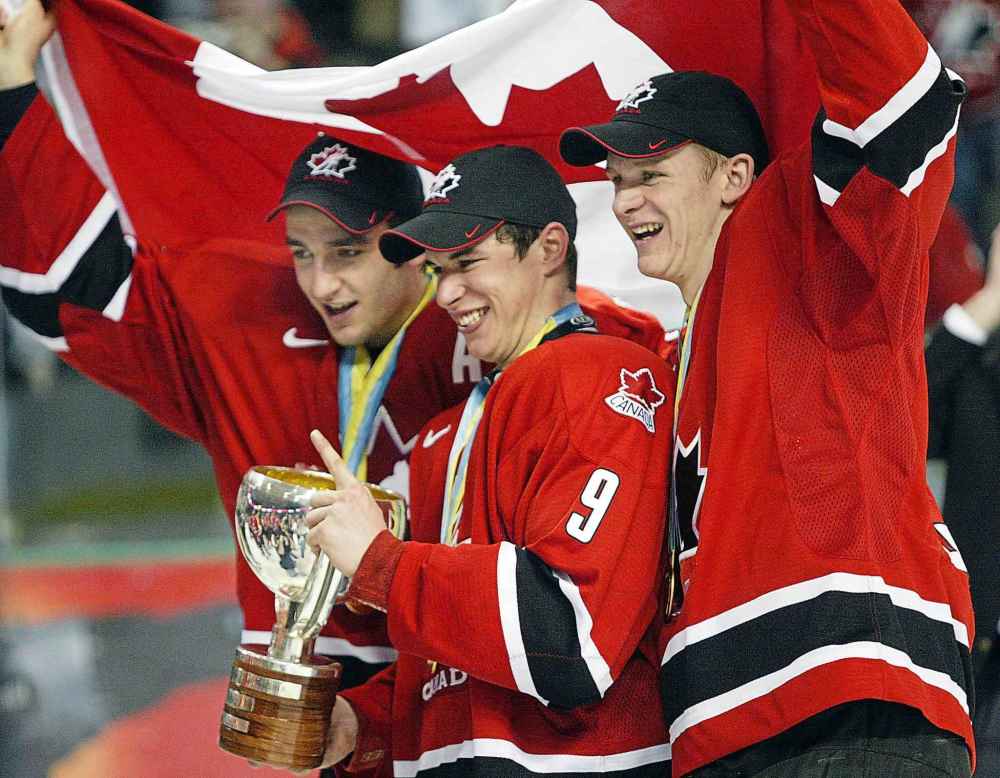 (CP PHOTO/Ryan Remiorz)
Team Canada's Patrice Bergeron, left, Sidney Crosby, center, and Corey Perry celebrate after defeating Russia 6-1 to win the gold medal at the World Junior Hockey Championships in Grand Forks, N.D., in 2005. Crosby said he's not surprised by the nastiness that Canadian hockey fans have shown towards this year's World Junior team.