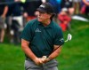 Phil Mickelson reacts to missing a birdie putt on the 9th green during first round play at the Travelers Championship golf tournament at TPC River Highlands, Thursday, June 20, 2019 in Cromwell, Conn.(Brad Horrigan/Hartford Courant via AP)