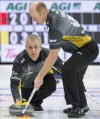 Jonathan Hayward/The Canadian Press
Team New Brunswick skip Terry Odishaw makes a shot as second Marc Lecocq sweeps during the 12th draw against Team Ontario at the Brier in Brandon, Man. Wednesday, March 6, 2019.