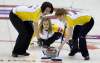 Jonathan Hayward / The Canadian Press
Jennifer Jones, centre, makes a shot as second Jill Officer, left, and lead Dawn Askin sweep during the game against Alberta at the Scotties Tournament of Hearts in Red Deer this afternoon. Heather Nedohin defeated Manitoba 8-6.