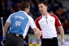 JONATHAN HAYWARD / the canadian press
Newfoundland and Labrador skip Brad Gushue, right, shakes hands with Quebec second Eric Sylvain following Friday afternoon's game. Gushue and his squad won 5-4.