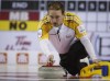 Jeff McIntosh / THE CANADIAN PRESS
Manitoba skip Reid Carruthers delivers a rock as his tem plays Northern Ontario during curling action at the Brier in Calgary, Tuesday.