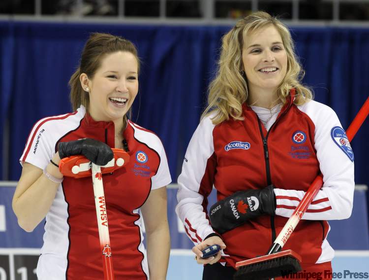 CP
Team Canada third Kaitlyn Lawes (left) and skip Jennifer Jones smile during their match against Newfoundland in the afternoon draw at the 2011 Tournament of Hearts in Charlottetown, PEI on Tuesday.