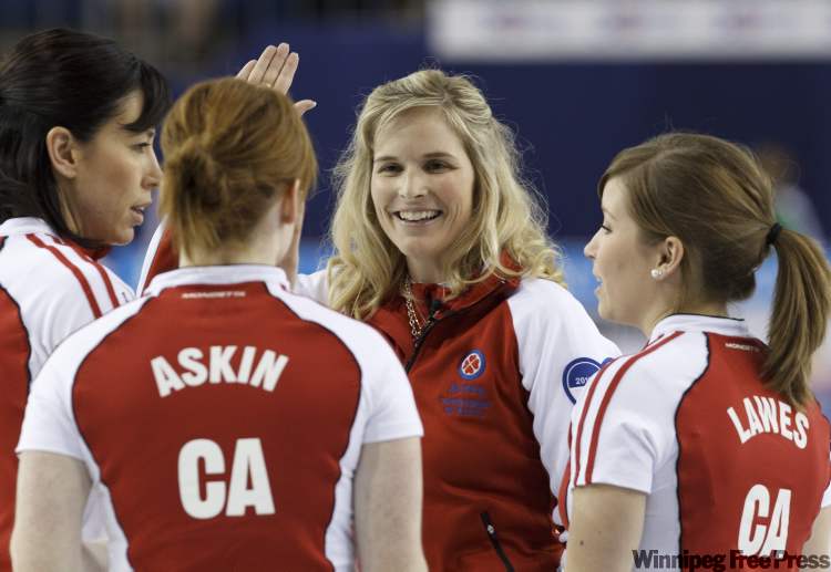 Frank Gunn / the canadian press
Team Canada skip Jennifer Jones (centre) celebrates with second Jill Officer (left), lead Dawn Askin and third Kaitlyn Lawes after defeating Saskatchewan in their playoff game at the 2011 Tournament of Hearts in Charlottetown on Friday.