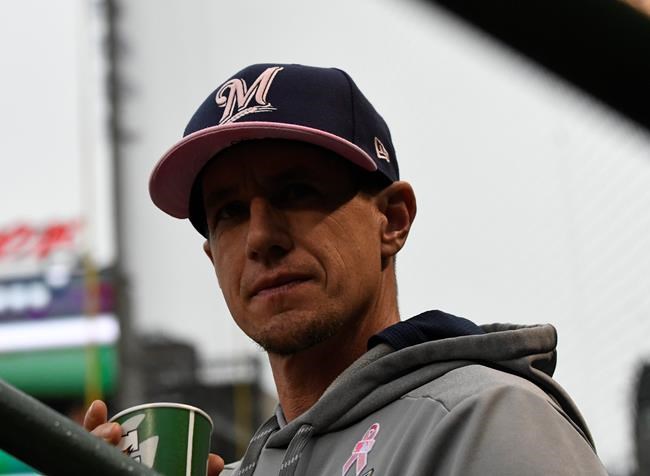 Milwaukee Brewers manager Craig Counsell (30) in the dugout before a baseball game against the Chicago Cubs, Sunday, May, 12, 2019, in Chicago. (AP Photo/David Banks)