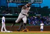 Pittsburgh Pirates' Francisco Cervelli reacts toward the Chicago Cubs dugout as he rounds third on a home run during the first inning of a baseball game in Chicago, Wednesday, April 10, 2019. (AP Photo/Nuccio DiNuzzo)
