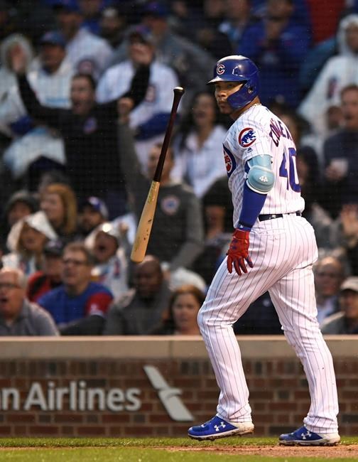 Chicago Cubs' Willson Contreras watches his grand slam during the first inning of the team's baseball game against the Chicago White Sox on Wednesday, June 19, 2019, at Wrigley Field in Chicago. (AP Photo/Paul Beaty)