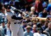 Milwaukee Brewers' Ryan Braun hits a solo home run against the Chicago Cubs during the fourth inning of a baseball game Friday, May 10, 2019, in Chicago. (AP Photo/Nam Y. Huh)