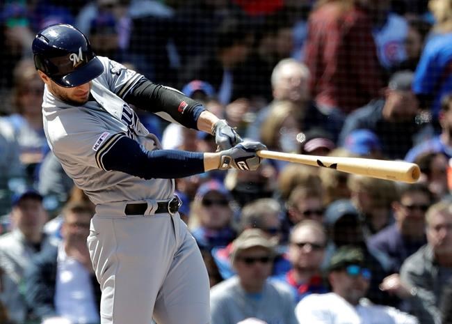 Milwaukee Brewers' Ryan Braun hits a solo home run against the Chicago Cubs during the fourth inning of a baseball game Friday, May 10, 2019, in Chicago. (AP Photo/Nam Y. Huh)