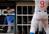 Chicago Cubs manager Joe Maddon watches Javier Baez during the first inning of the team's baseball game against the Chicago White Sox in Chicago, Saturday, July 6, 2019. (AP Photo/Nam Y. Huh)