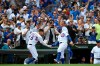 Chicago Cubs' Nicholas Castellanos (6) celebrates with teammate Javier Baez right, after hitting a two-run home run during the second inning of a baseball game against the Milwaukee Brewers Friday, Aug 30, 2019, in Chicago. (AP Photo/Paul Beaty)