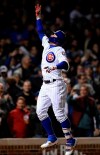 Chicago Cubs' Javier Baez celebrates at home plate after hitting a three-run home run during the sixth inning of a baseball game against the Los Angeles Dodgers, Wednesday, April 24, 2019, in Chicago. (AP Photo/Paul Beaty)