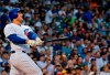 Chicago Cubs' Anthony Rizzo watches his home run during the first inning of the team's baseball game against the San Francisco Giants on Tuesday, Aug. 20, 2019, in Chicago. (AP Photo/Matt Marton)