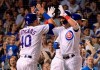 CORRECTS TO FIFTH INNING - Chicago Cubs' Willson Contreras (40) congratulates Albert Almora Jr. (5) on his on his grand slam against the Philadelphia Phillies during the fifth inning of a baseball game Wednesday, May 22, 2019, in Chicago. (AP Photo/Mark Black)