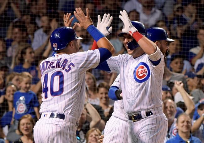 CORRECTS TO FIFTH INNING - Chicago Cubs' Willson Contreras (40) congratulates Albert Almora Jr. (5) on his on his grand slam against the Philadelphia Phillies during the fifth inning of a baseball game Wednesday, May 22, 2019, in Chicago. (AP Photo/Mark Black)