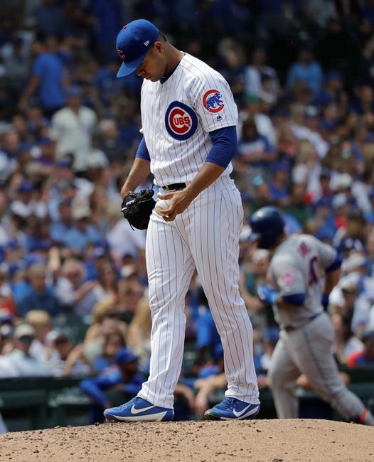 Chicago Cubs starting pitcher Jose Quintana looks down as New York Mets' Wilson Ramos rounds the bases after hitting a two-run home run during the fifth inning of a baseball game in Chicago, Saturday, June 22, 2019. (AP Photo/Nam Y. Huh)