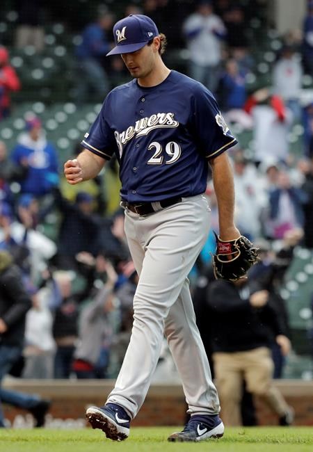 Milwaukee Brewers relief pitcher Burch Smith leaves the field after Chicago Cubs' Willson Contreras hit the game-winning solo home run during the 15th inning of a baseball game Saturday, May 11, 2019, in Chicago. The Cubs won 2-1. (AP Photo/Nam Y. Huh)