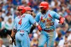 St. Louis Cardinals' Marcell Ozuna, right, celebrates with teammates Yadier Molina, left, and Paul Goldschmidt, center, after hitting a two-run home run during the seventh inning of baseball game against the Chicago Cubs Saturday, Sept. 21, 2019, in Chicago. (AP Photo/Paul Beaty)