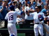 Chicago Cubs' Ben Zobrist (18) is greeted by Kyle Schwarber (12) after scoring against the Pittsburgh Pirates during the second inning of a baseball game, Monday, April 8, 2019, in Chicago. (AP Photo/David Banks)