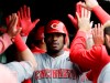 Cincinnati Reds' Yasiel Puig celebrates with teammates after hitting a two-run home run against the Chicago Cubs during the sixth inning of a baseball game Friday, May 24, 2019, in Chicago. (AP Photo/Nam Y. Huh)