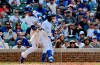 Chicago Cubs' Javier Baez (9) hits a three run home run during the eighth inning of a baseball game against the New York Mets Sunday, June 23, 2019, in Chicago. (AP Photo/Matt Marton)