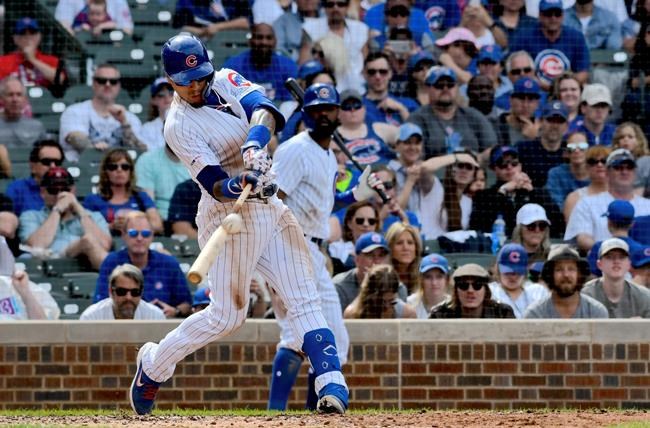 Chicago Cubs' Javier Baez (9) hits a three run home run during the eighth inning of a baseball game against the New York Mets Sunday, June 23, 2019, in Chicago. (AP Photo/Matt Marton)