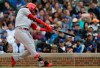 Cincinnati Reds' Jesse Winker hits a one-run double against the Chicago Cubs during the seventh inning of a baseball game Friday, May 24, 2019, in Chicago. (AP Photo/Nam Y. Huh)
