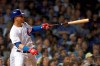 Chicago Cubs' Willson Contreras watches his home run off Cincinnati Reds relief pitcher Robert Stephenson during the seventh inning of a baseball game Wednesday, Sept. 18, 2019, in Chicago. (AP Photo/Charles Rex Arbogast)