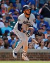 San Diego Padres' Fernando Tatis Jr., watches his two-run single during the ninth inning of a baseball game against the Chicago Cubs in Chicago, Sunday, July 21, 2019. (AP Photo/Nam Y. Huh)
