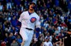 Chicago Cubs' Javier Baez reacts after hitting a home run during the eighth inning of the team's baseball game against the St. Louis Cardinals on Saturday, May 4, 2019, in Chicago. (AP Photo/Matt Marton)