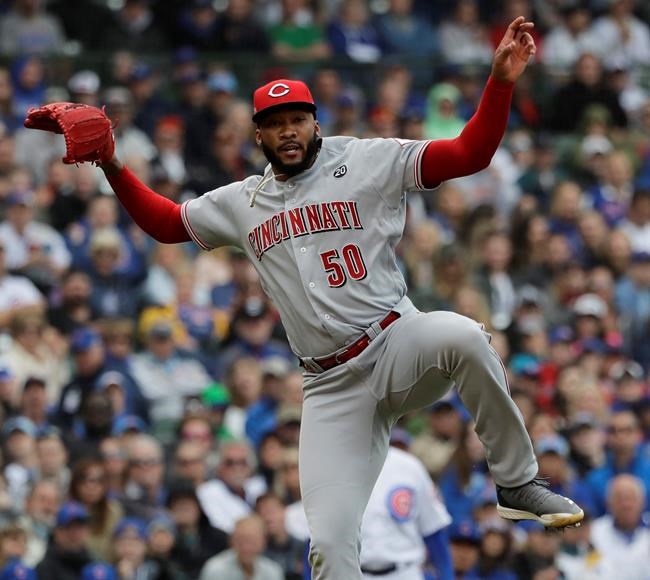 Cincinnati Reds relief pitcher Amir Garrett reacts after throwing out Chicago Cubs' Kris Bryant at first during the seventh inning of a baseball game Friday, May 24, 2019, in Chicago. The Reds won 6-5. (AP Photo/Nam Y. Huh)